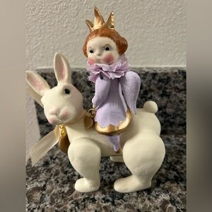 Whimsical Figurine with Child and Rabbit
